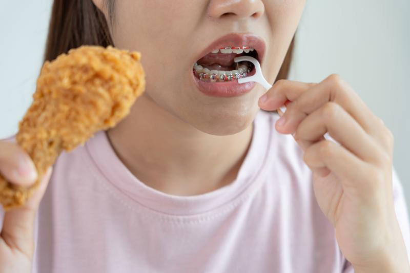 girl eating chicken